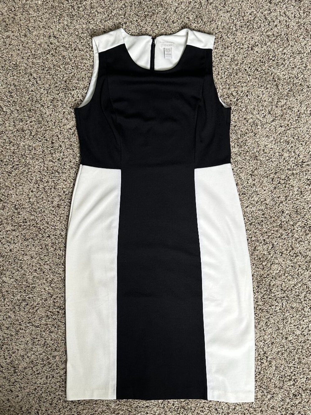 Women's dress in black and white, stylishly cut.